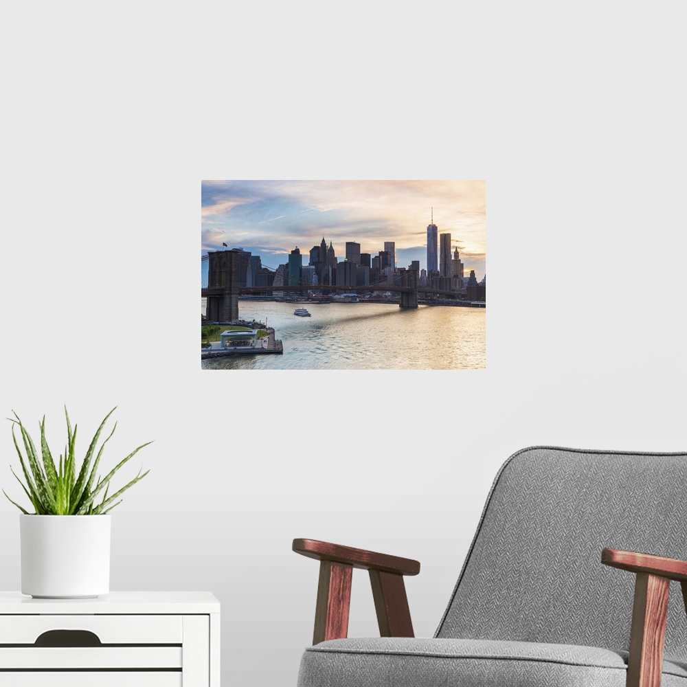 A modern room featuring USA, New York City, Brooklyn, Dumbo, Brooklyn Bridge, Manhattan skyline at sunset.