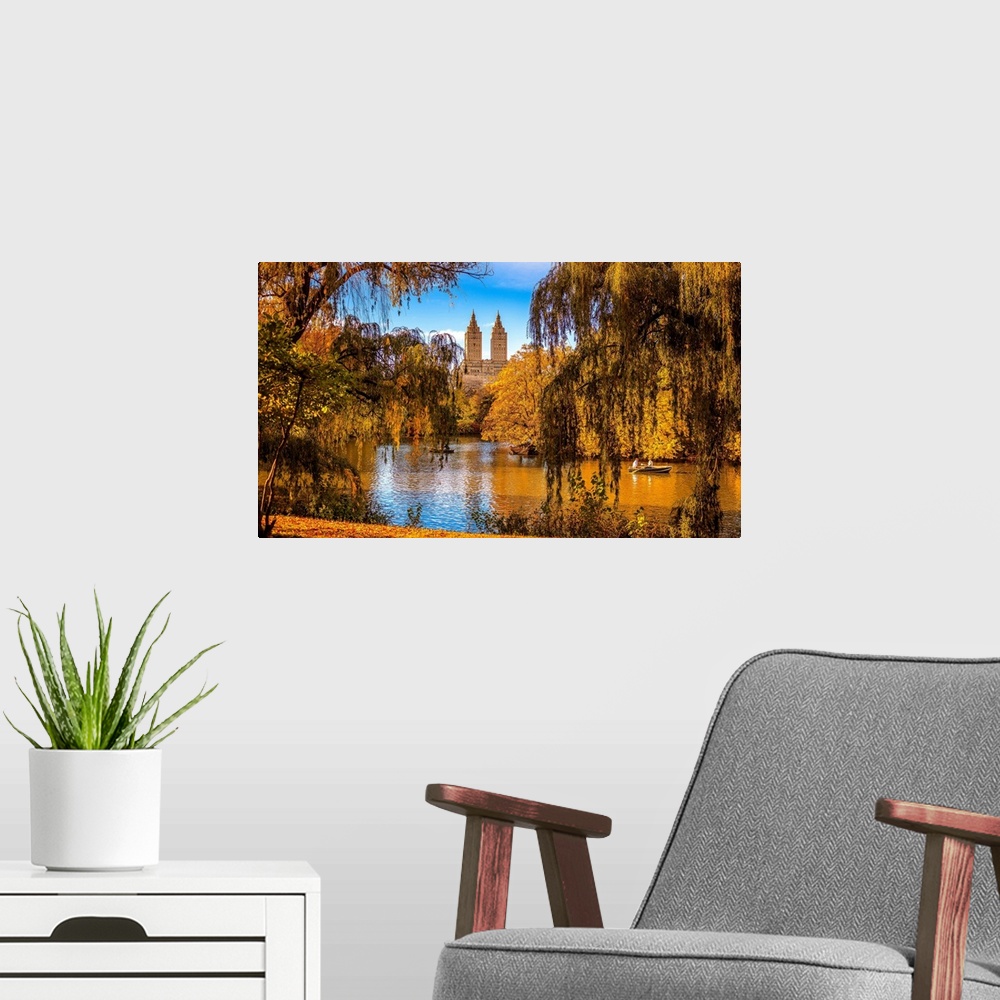 A modern room featuring USA, New York City, Manhattan, Central Park, The lake and San Remo apartment building, foliage.