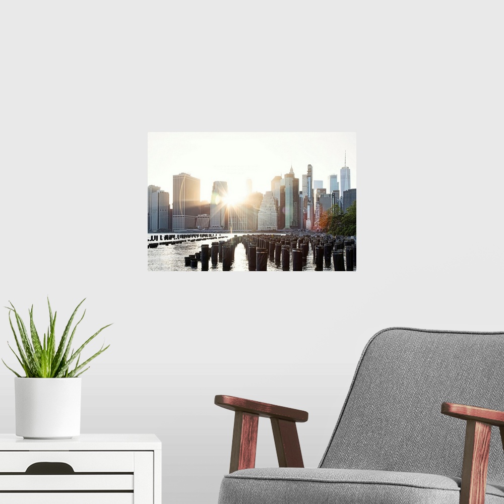 A modern room featuring New York City, View of New York City Skyline from Brooklyn Bridge Park.