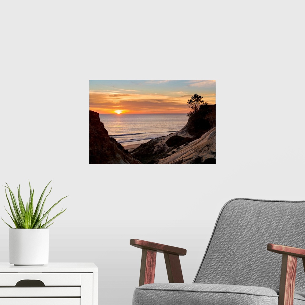A modern room featuring Portugal, Faro, Albufeira, Algarve, Praia da Falesia beach at sunset.