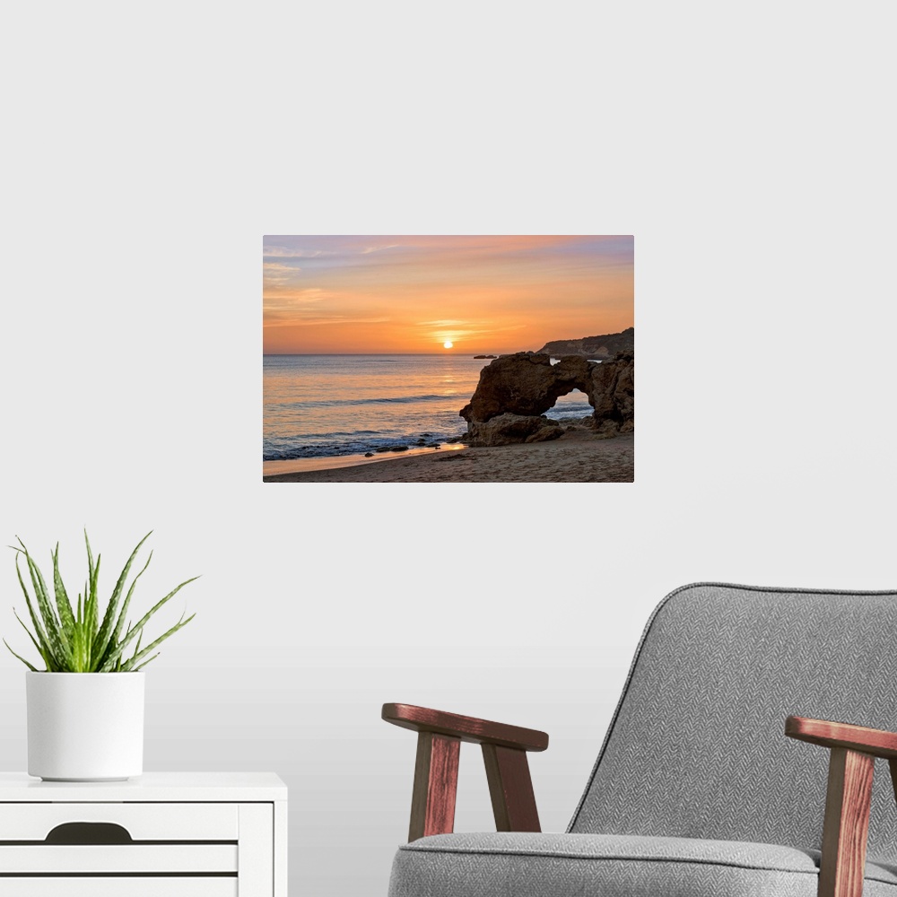 A modern room featuring Portugal, Faro, Algarve, Albufeira, Praia da Oura Beach at sunset.