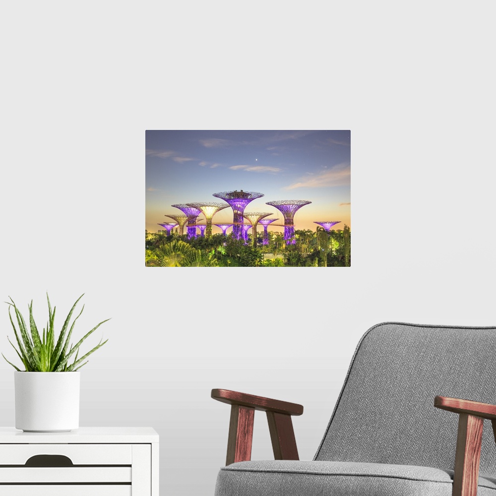 A modern room featuring Singapore, Singapore City, Gardens by the Bay park at sunrise.