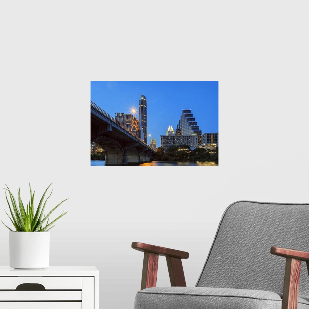 A modern room featuring Texas, Austin, Congress Avenue bridge looking toward Texas State Capital and downtown at dusk