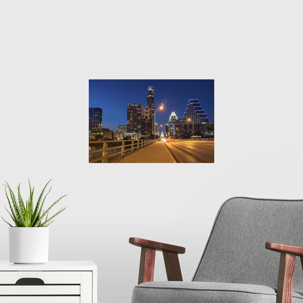 A modern room featuring Texas, Austin, Congress Avenue bridge looking toward Texas State Capital and downtown at dusk