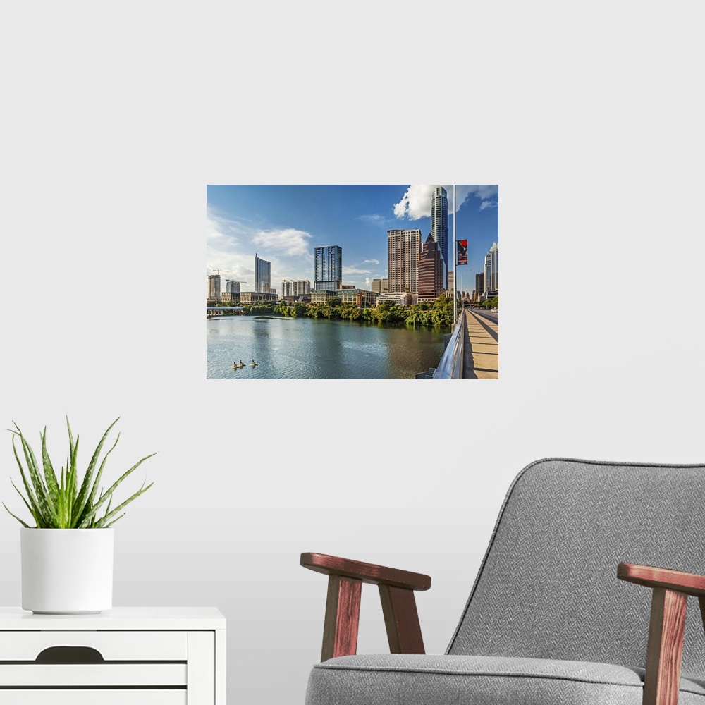 A modern room featuring Texas, Austin downtown skyline from Congress Ave. Bridge and Colorado River 360 Condominiums, The...