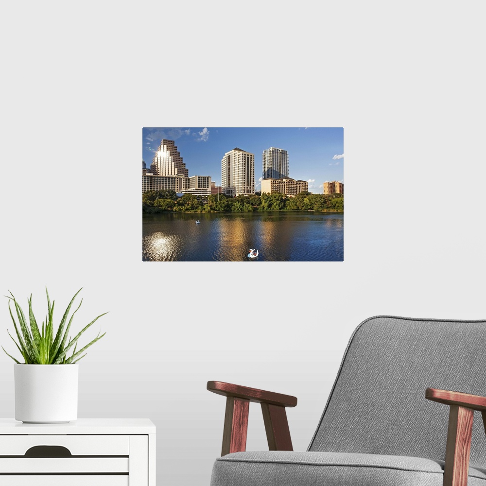 A modern room featuring Texas, Austin, view over Colorado River from Congress Ave. Bridge looking toward downtown with sw...
