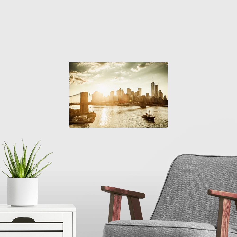 A modern room featuring USA, New York City, Brooklyn Bridge and Manhattan skyline at sunset with One World Trade Center a...