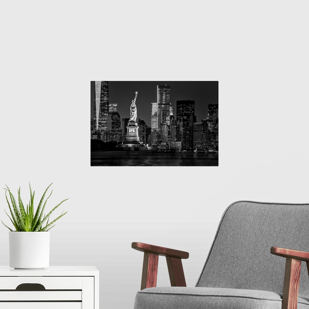 A modern room featuring USA, New York City, Lower Manhattan, Lower Manhattan skyline and Statue of Liberty at night.