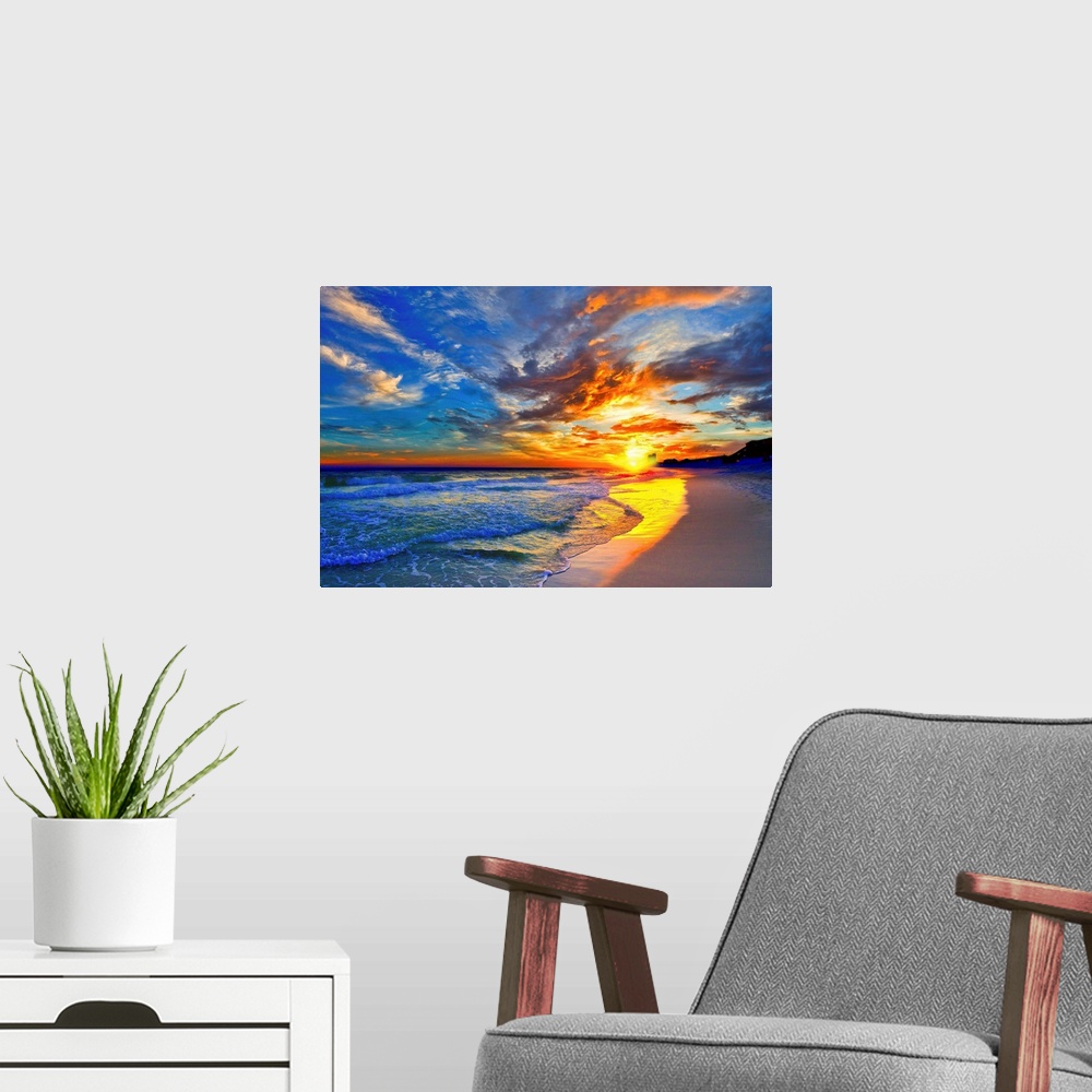 A modern room featuring An amazing sunset with red and blue sky and clouds. A blue seascape and beach below.
