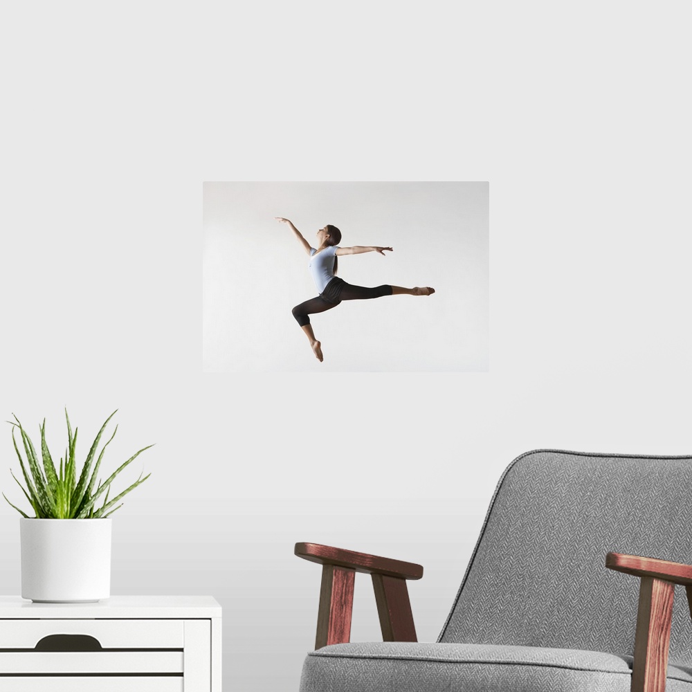 A modern room featuring Ballerina Leaping In Mid-Air