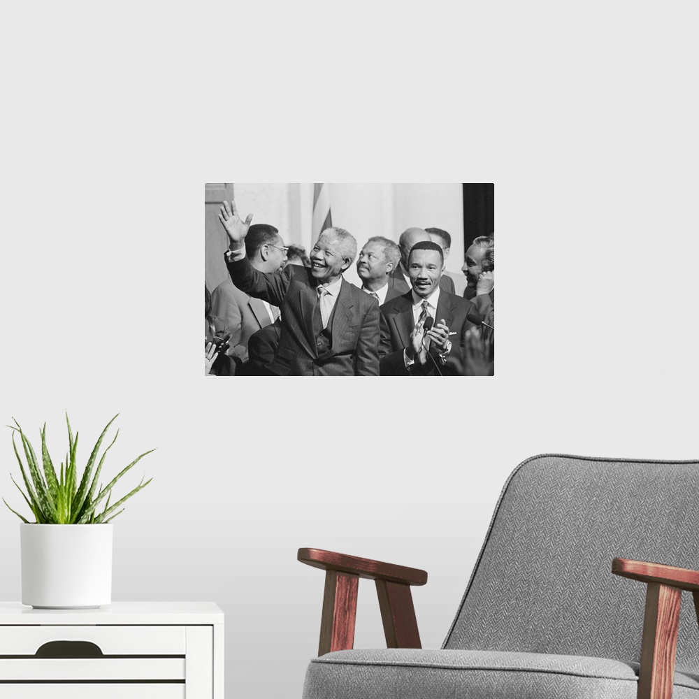 A modern room featuring President of South Africa, Nelson Mandela with members of the Congressional Black Caucus. Oct. 4,...