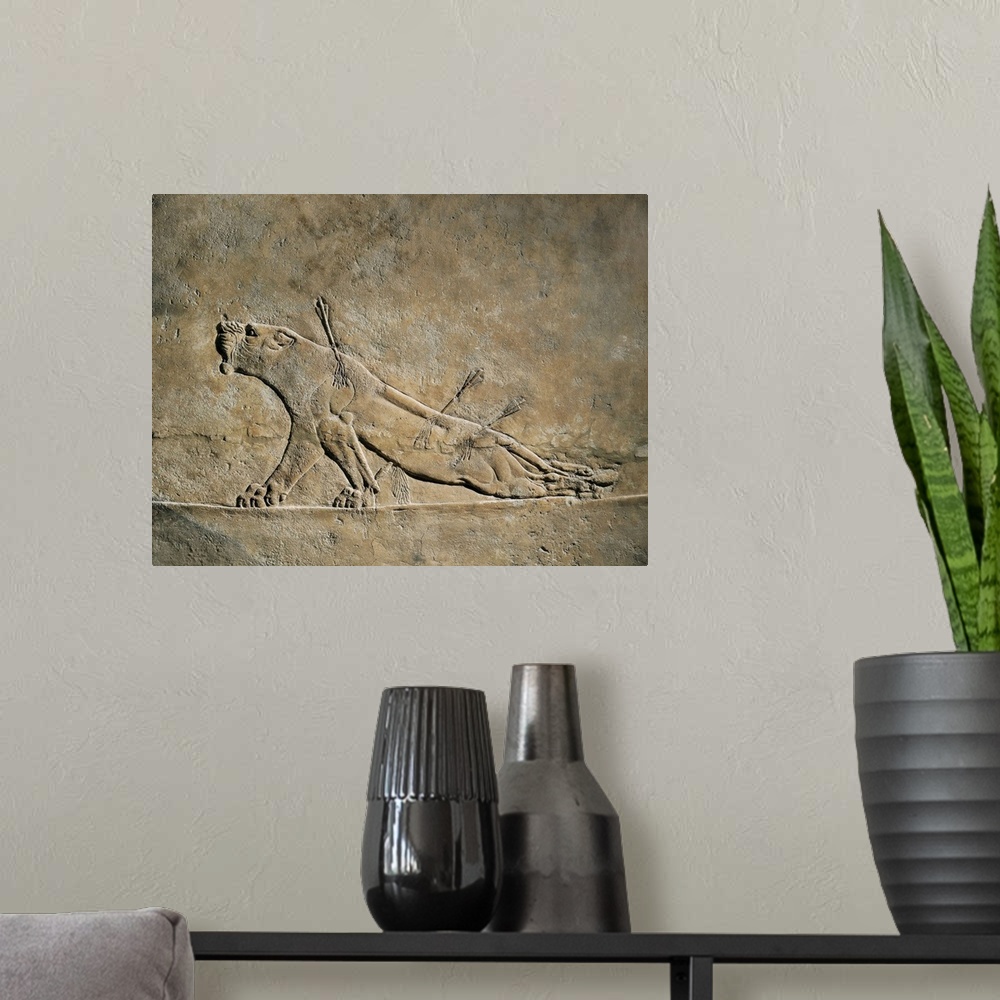 A modern room featuring The Dying Lion, Assyrian art