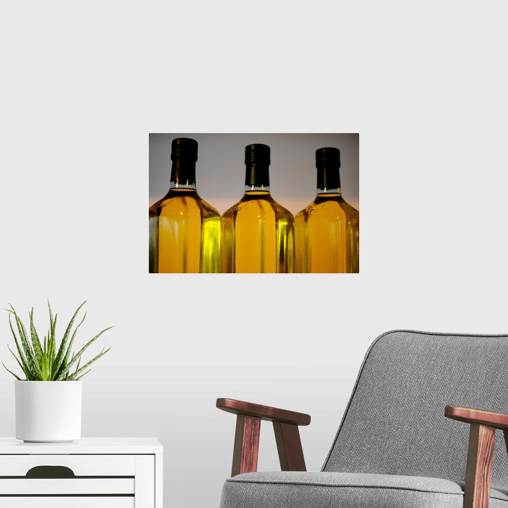 A modern room featuring Three Bottles Of Olive Oil
