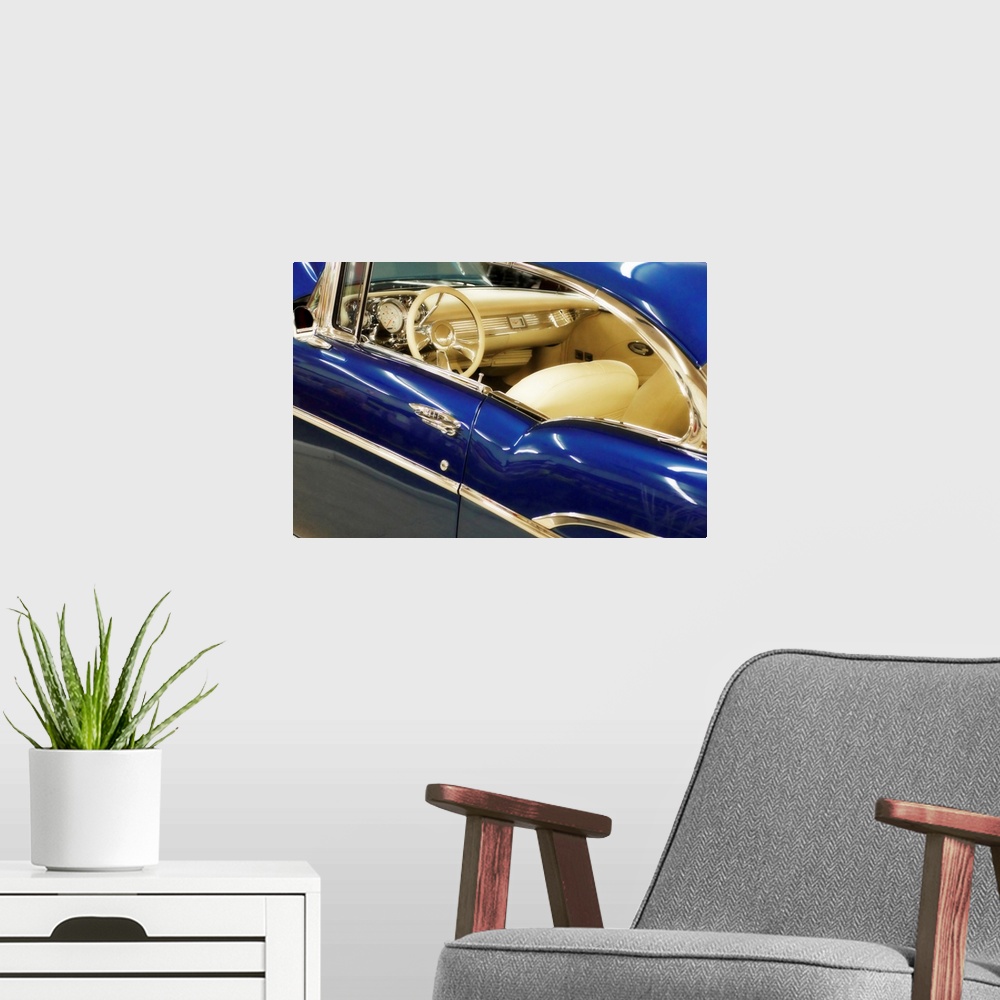 A modern room featuring This horizontal photograph is a close up of the interior of an antique car.