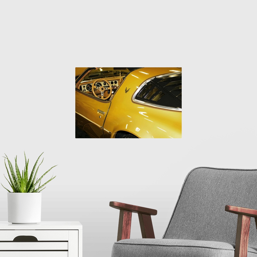 A modern room featuring Fine art photograph of a vintage car. The interior and steering wheel are visible.