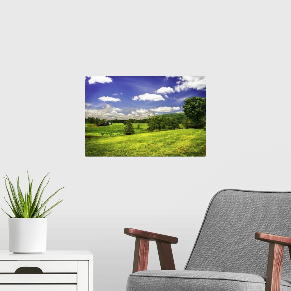 A modern room featuring Rolling green hills in the countryside on a sunny spring day.