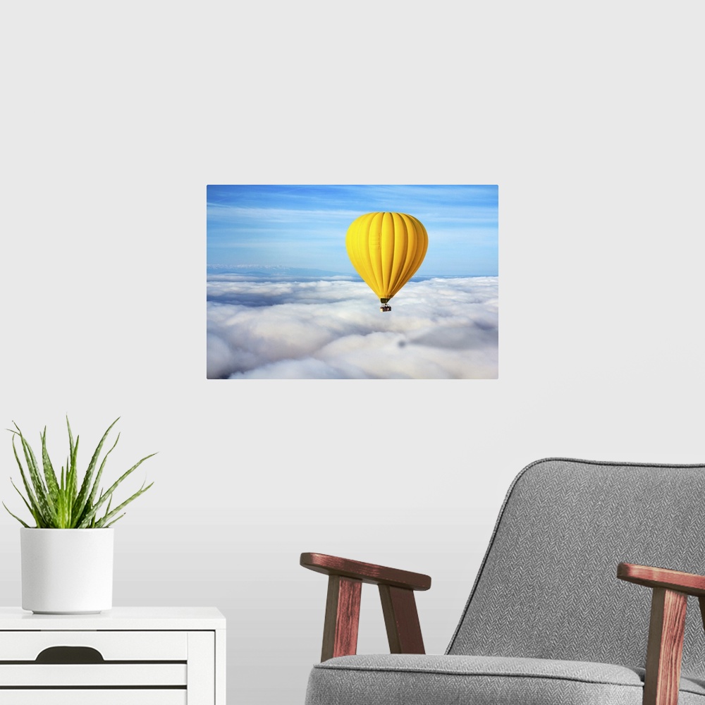 A modern room featuring A Lonely Yellow Hot Air Balloon Floats Above The Clouds