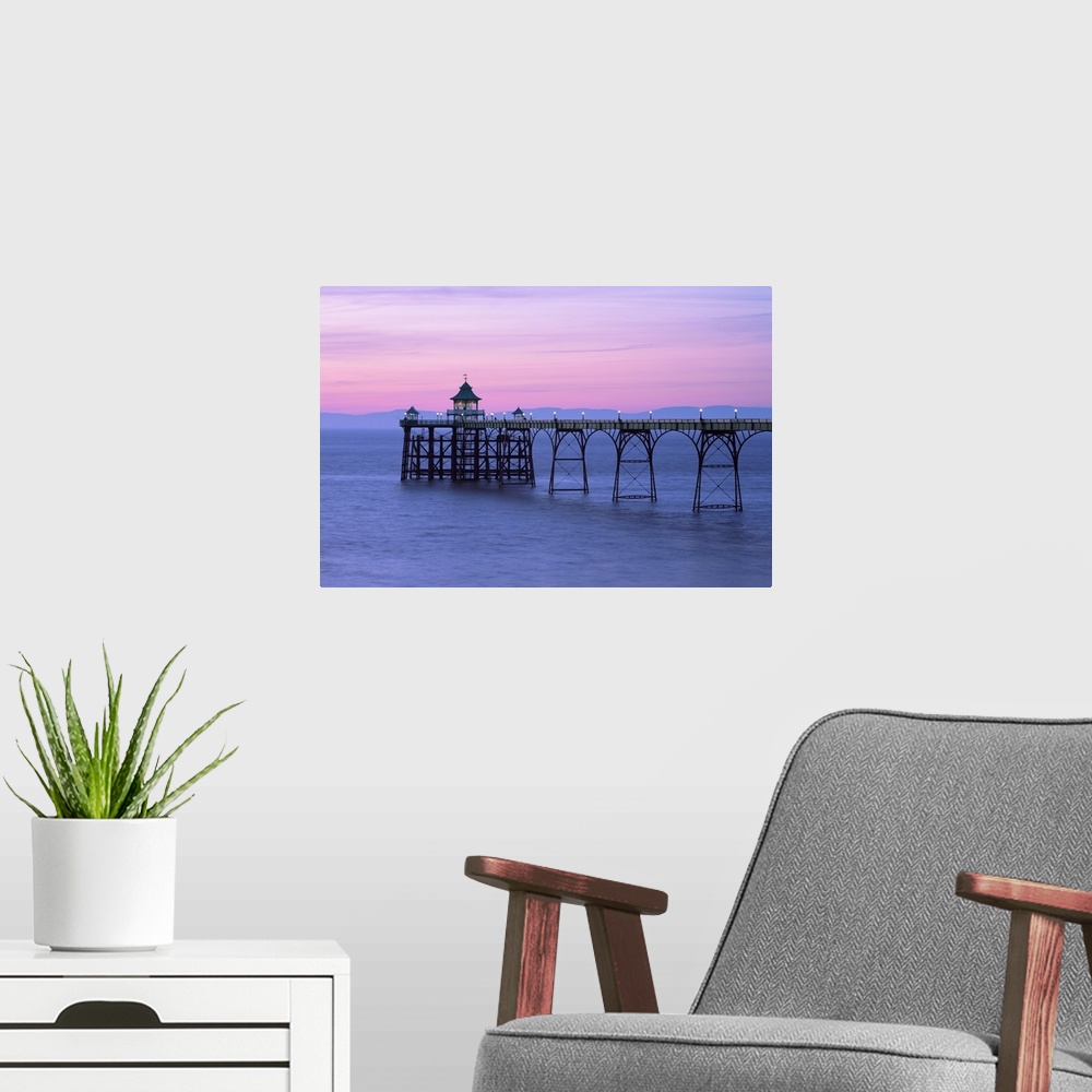 A modern room featuring A pink dusk sky over Clevedon Pier in Somerset.