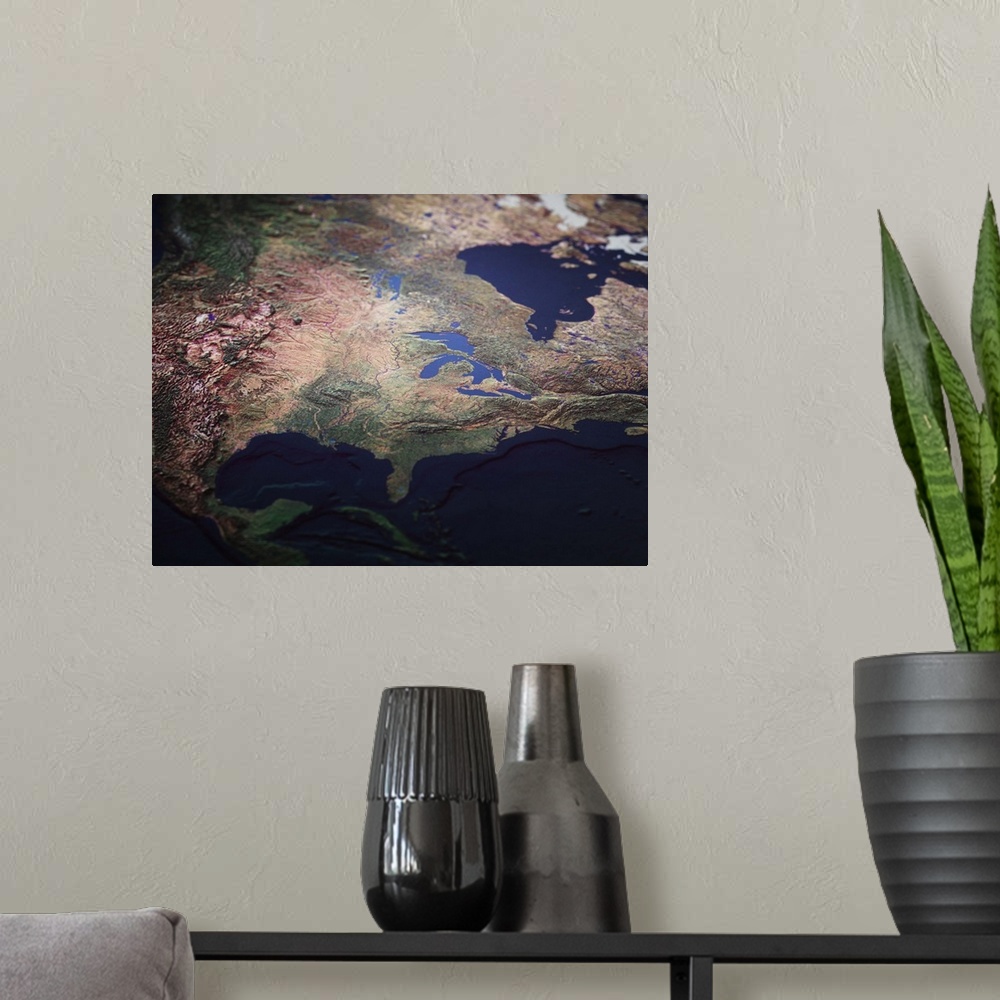 A modern room featuring A topographic map of USA from a satellite view