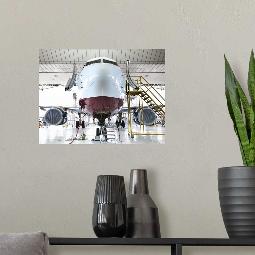A modern room featuring Airplane docked in hangar