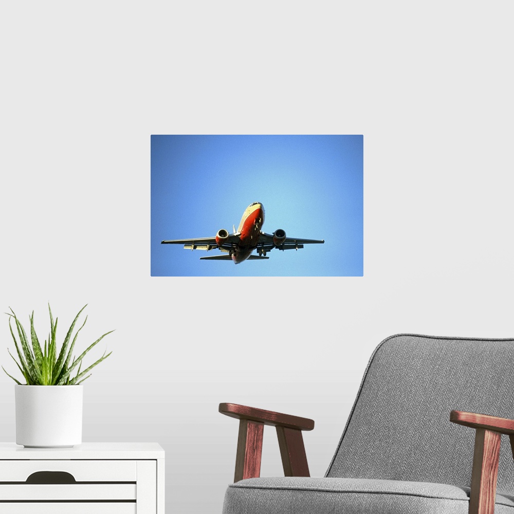 A modern room featuring airplane in blue sky