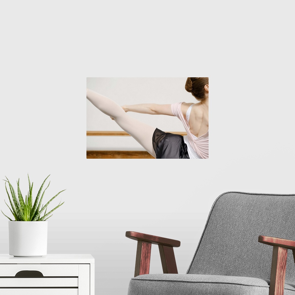 A modern room featuring Ballerina stretching