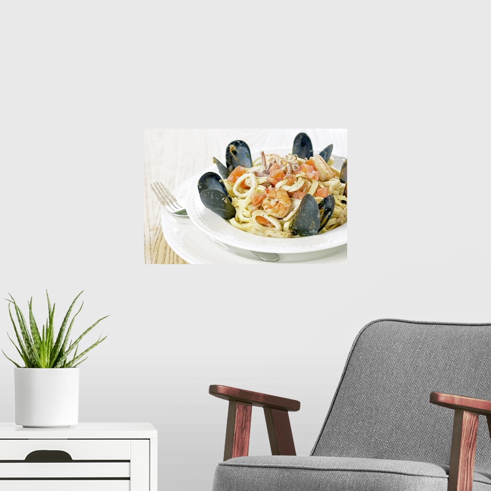 A modern room featuring Bowl of fresh seafood and pasta