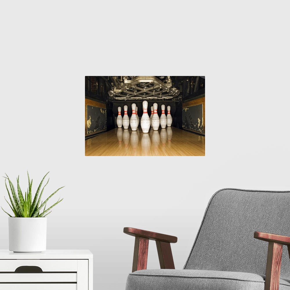 A modern room featuring Bowling pins and machine
