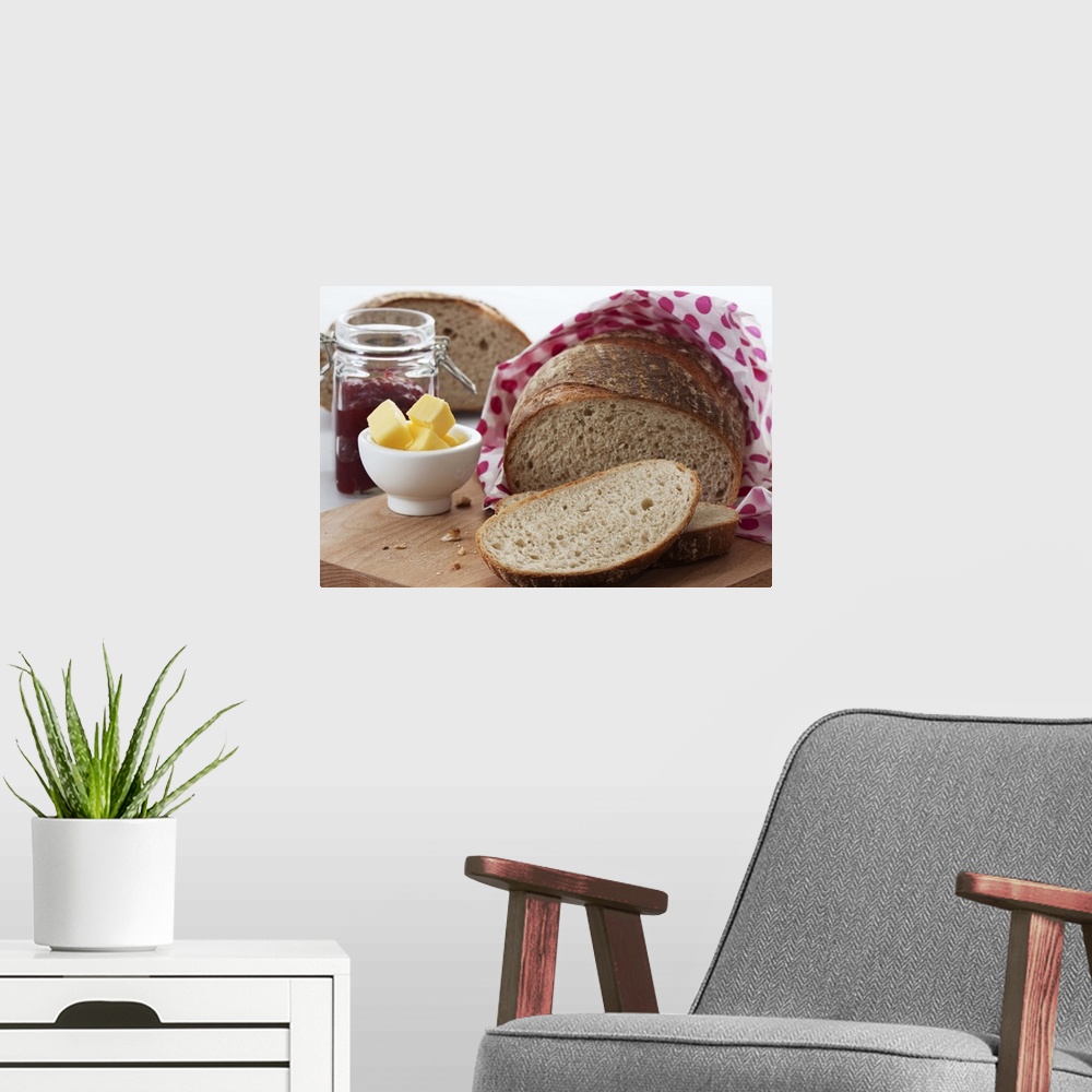 A modern room featuring Bread, butter and jam on chopping board