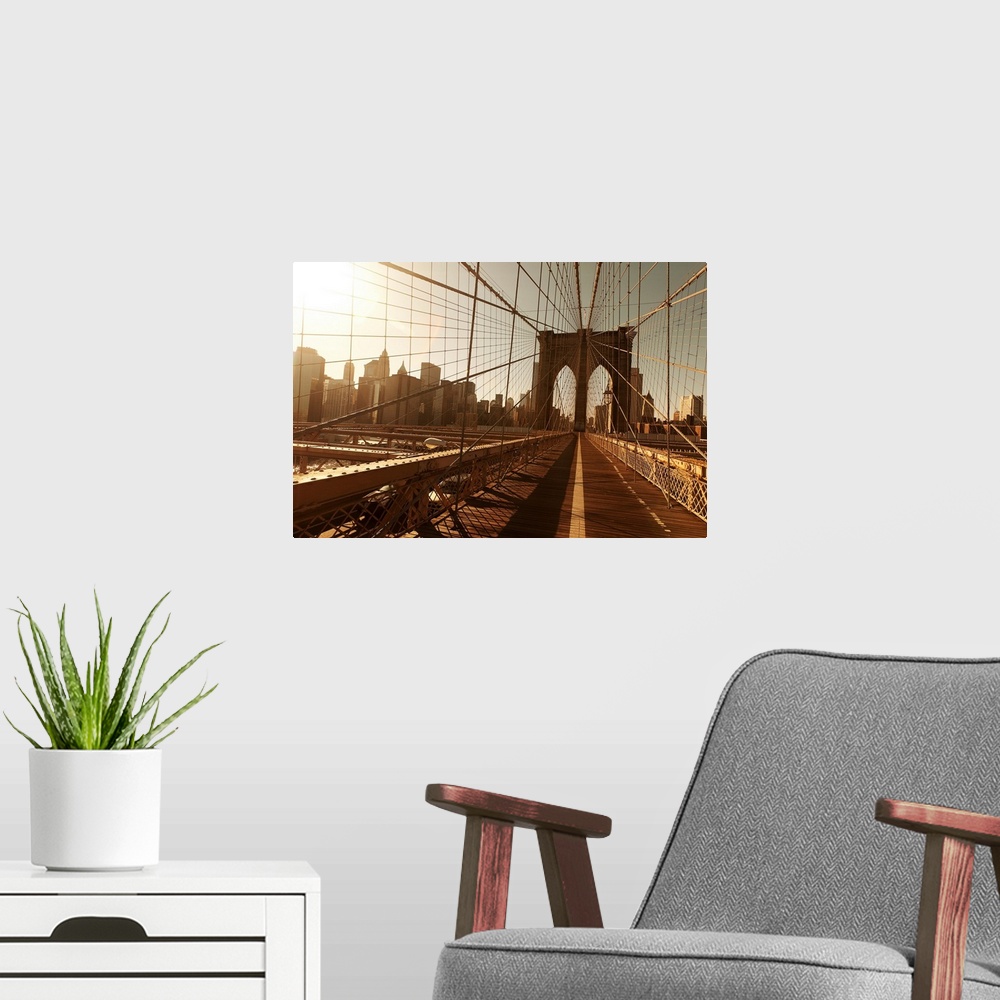 A modern room featuring Landscape, oversized photograph of the Brooklyn Bridge, taken through a multitude of cables, with...
