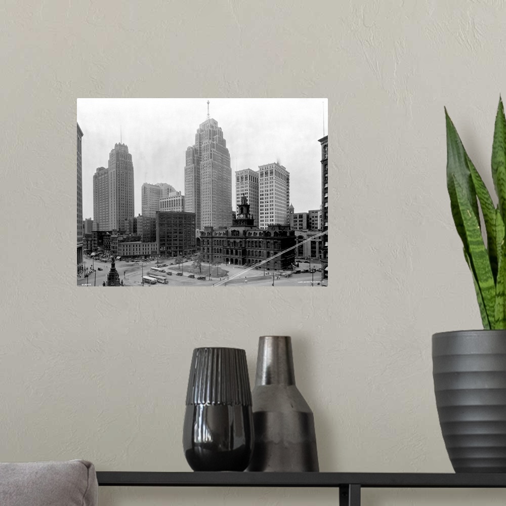 A modern room featuring The Guardian Building (tall tower on l) and the Penobscot Building (tall tower on r) tower over a...