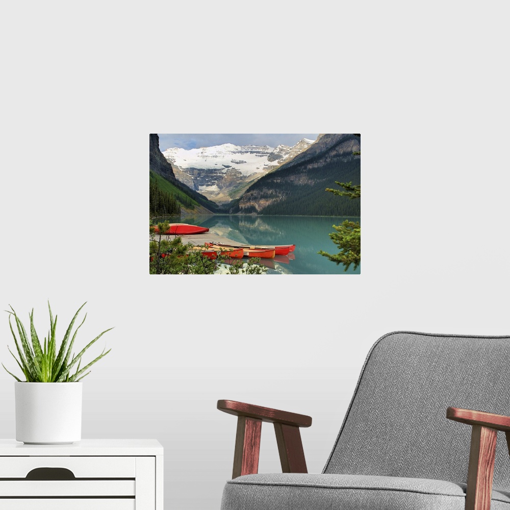 A modern room featuring red canoes on Lake Louise in Banff National Park