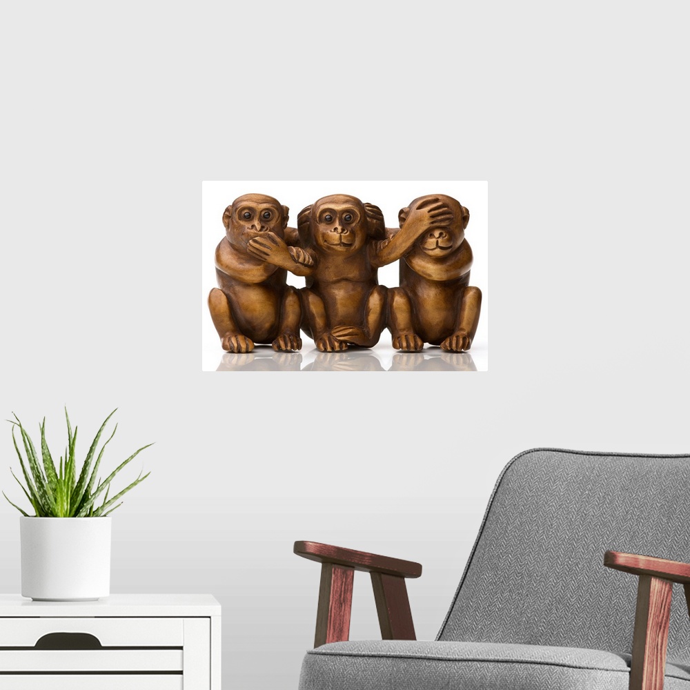 A modern room featuring Carving of three wooden monkeys