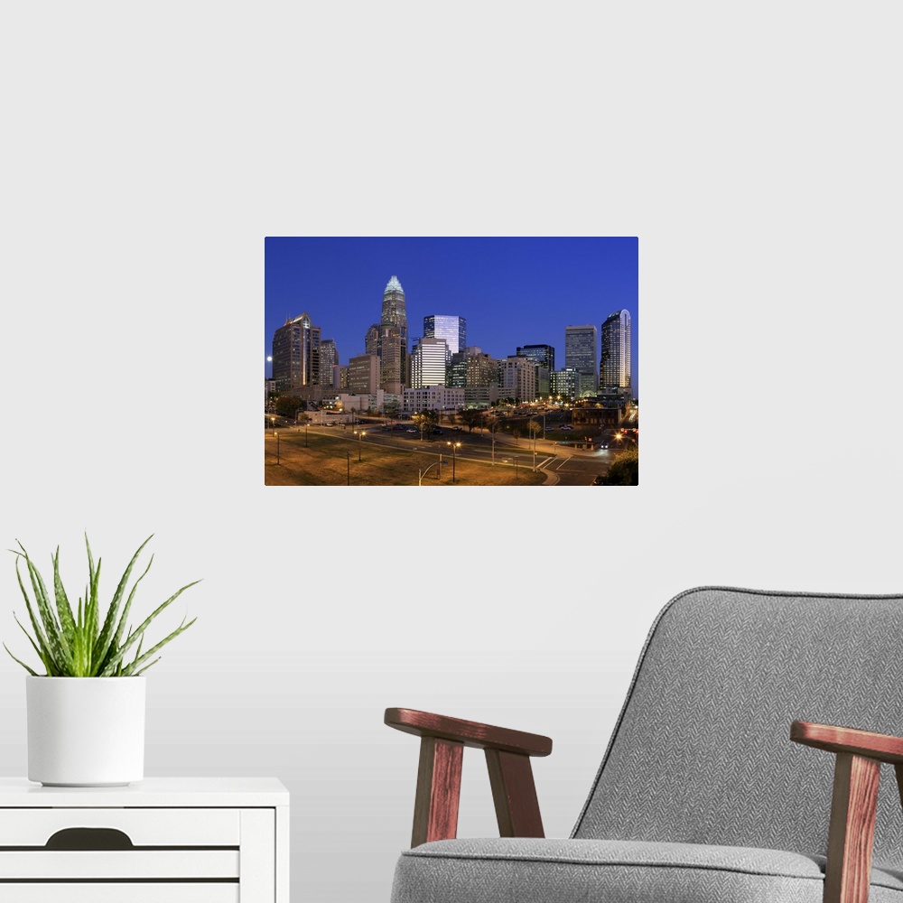 A modern room featuring Downtown Charlotte, North Carolina skyline at night