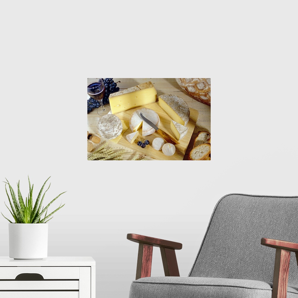 A modern room featuring Docor perfect for the kitchen of several types of cheeses on a cutting board surround by bread, g...
