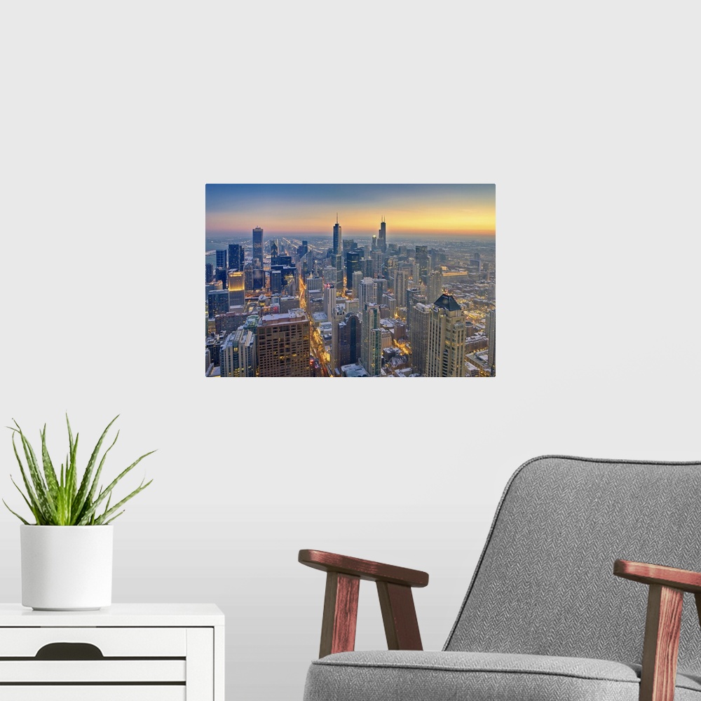 A modern room featuring Chicago skyline in blue hour.