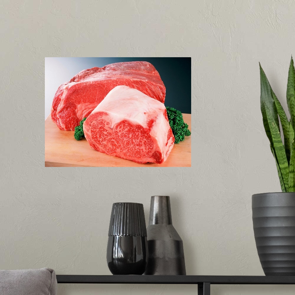 A modern room featuring Chuck of beef on a wooden cutting board