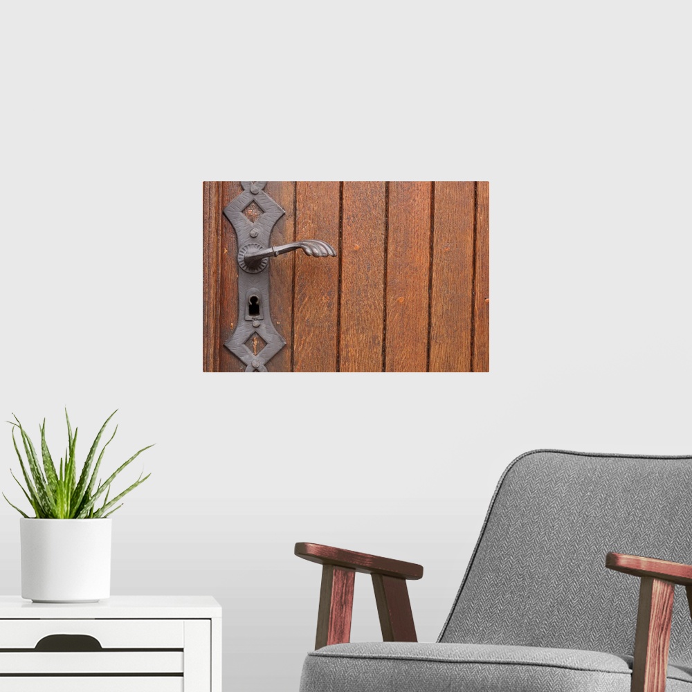 A modern room featuring Close-up of lock on wooden door