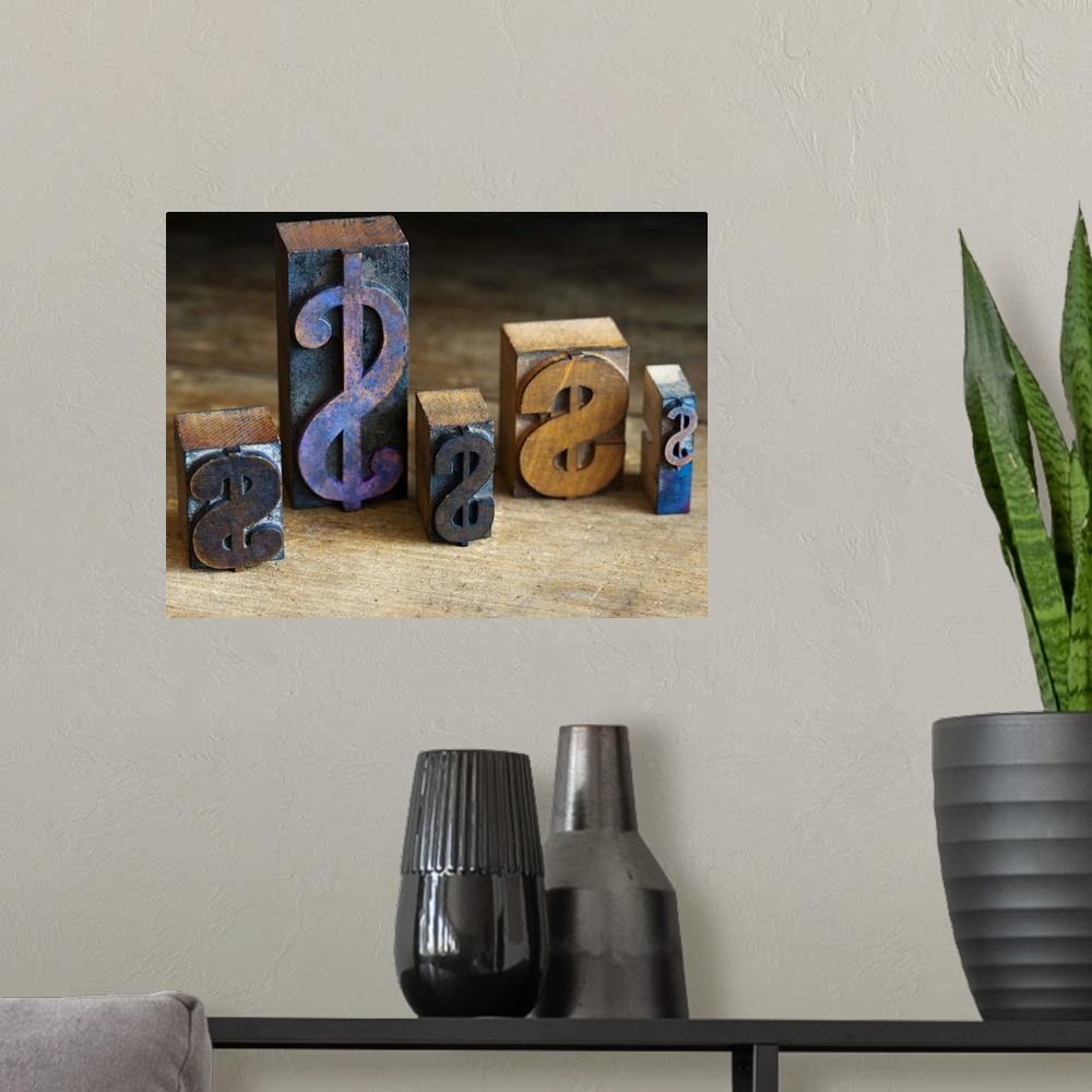 A modern room featuring Close up of printing blocks with dollar sign on wood
