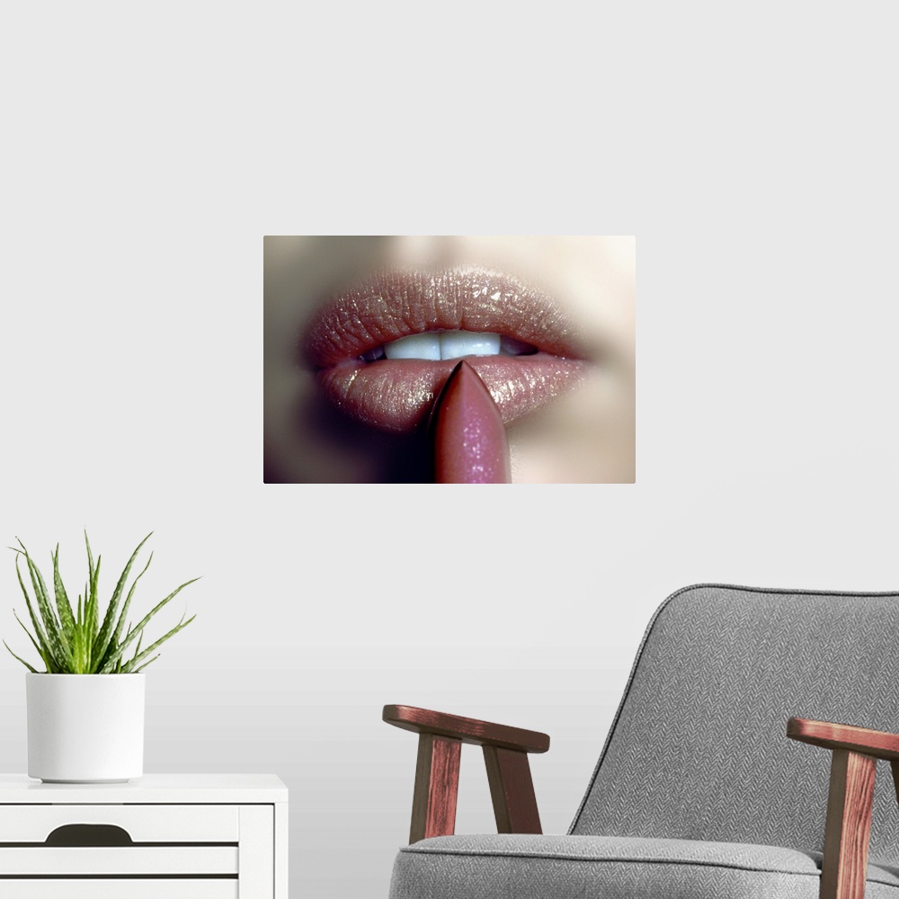 A modern room featuring Close-up of woman applying a glitter lipstick