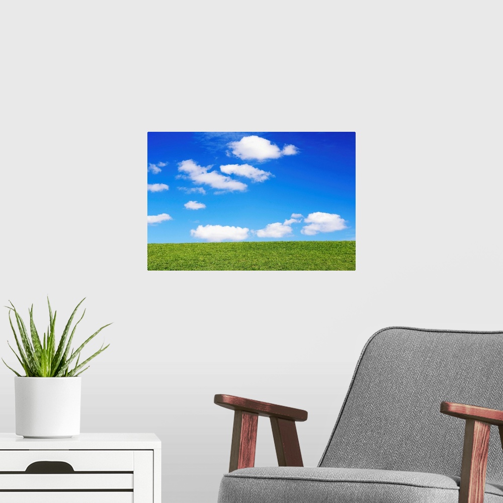 A modern room featuring Clouds In Blue Sky Over Green Grass