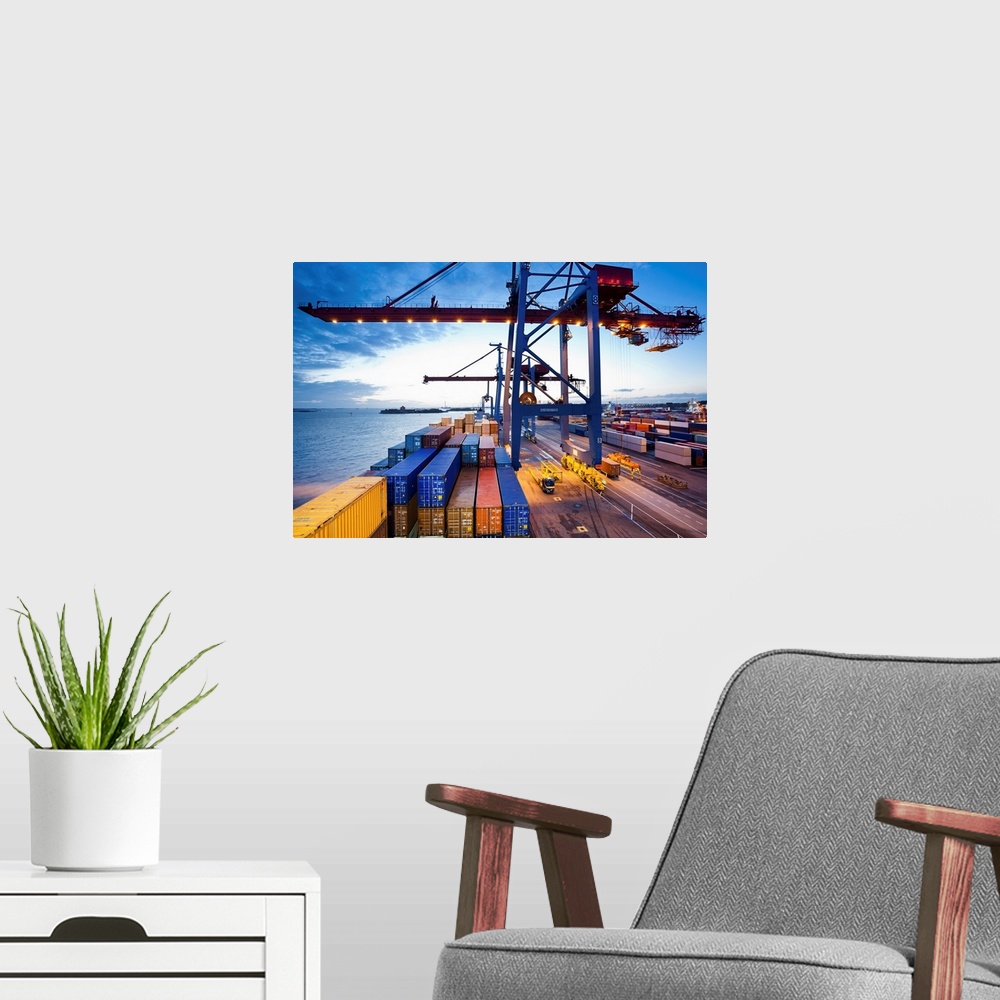 A modern room featuring Container terminal at dusk, view from cargo ship