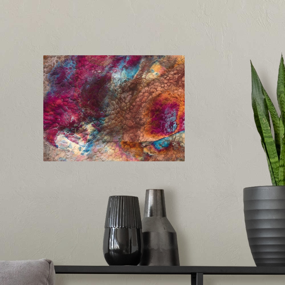A modern room featuring Abstract artwork of a piece of metal that has various colors swirled around it.