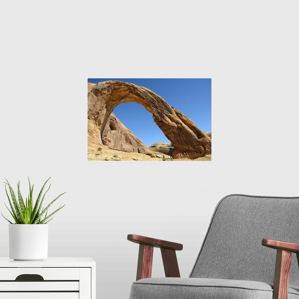 A modern room featuring Corona Arch against clear sky in Moab, Utah.