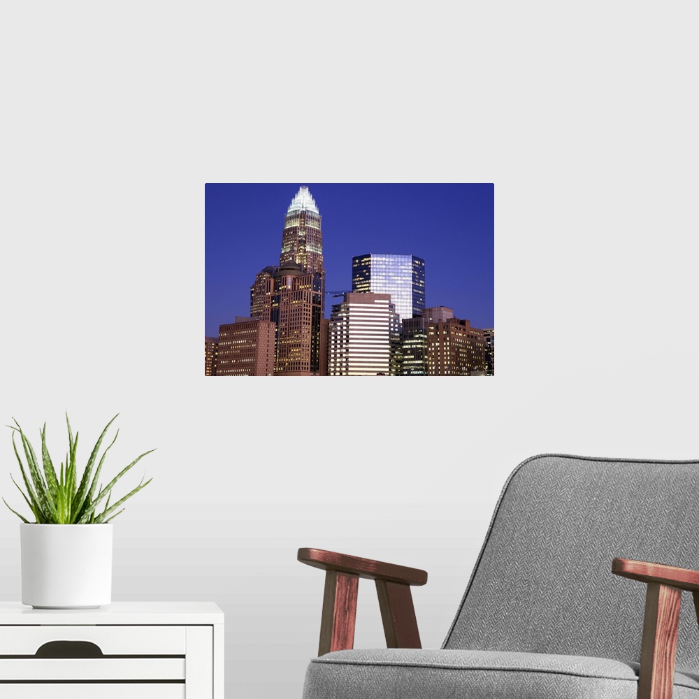 A modern room featuring Downtown Charlotte, North Carolina at night