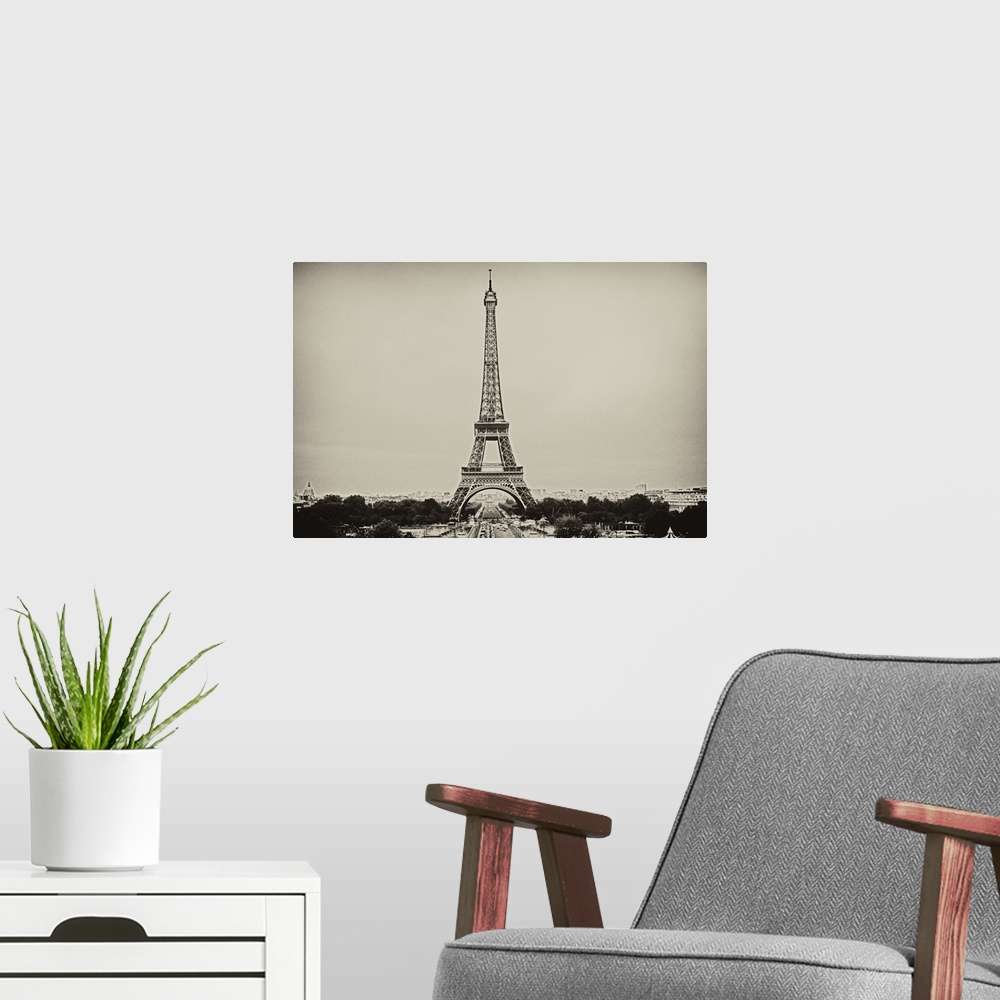 A modern room featuring Eiffel Tower in old style black and white image.