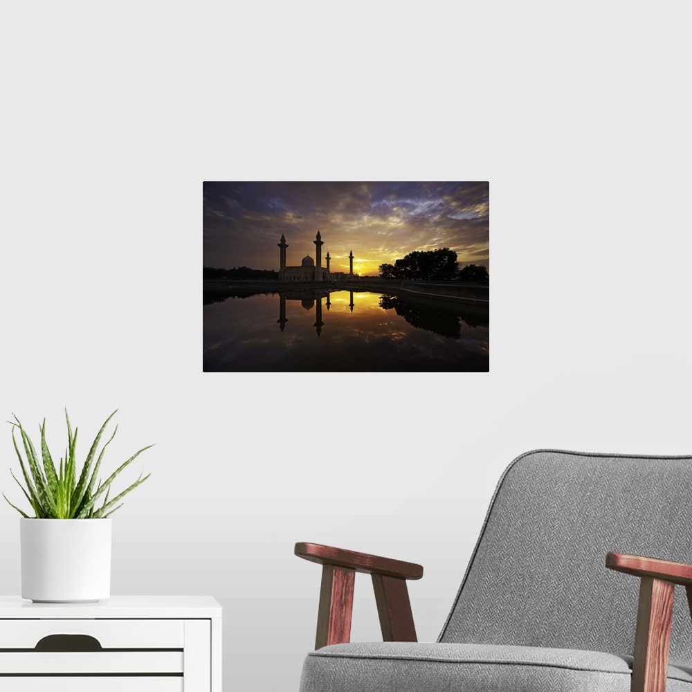 A modern room featuring Sunrise over the Tengku Ampuan Jemaah Mosque, Bukit Jelutong, Shah Alam. The sky turns the most b...