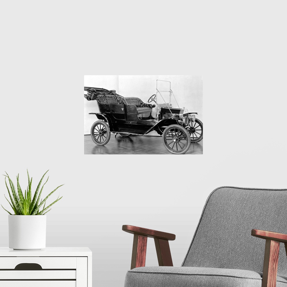A modern room featuring The first Model T Ford, built in 1908.