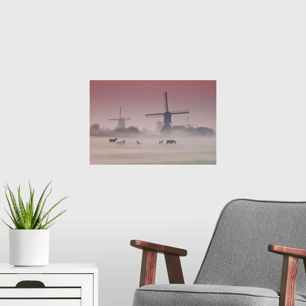 A modern room featuring Sunrise and morning fog with Silhouetted Windmills and horses in field Kinderdijk, Netherlands