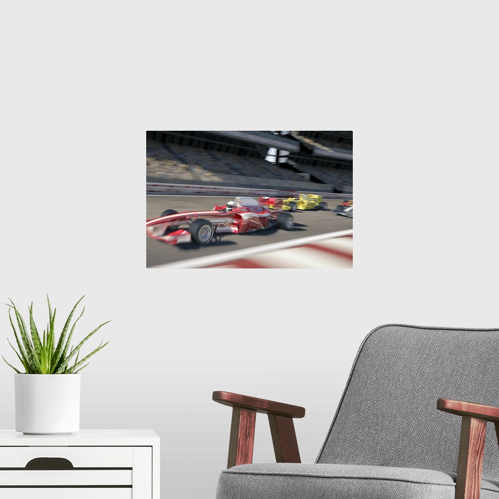 A modern room featuring Formula one racing cars speeding down the straight in the track in front of a stadium filled with...